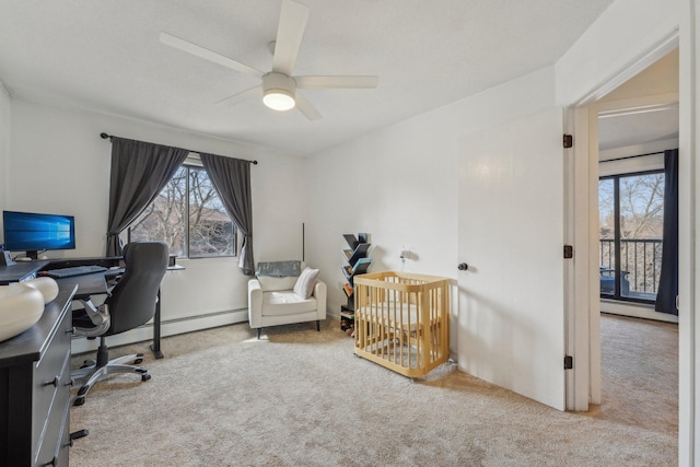 bedroom with a baseboard heating unit, carpet flooring, and ceiling fan
