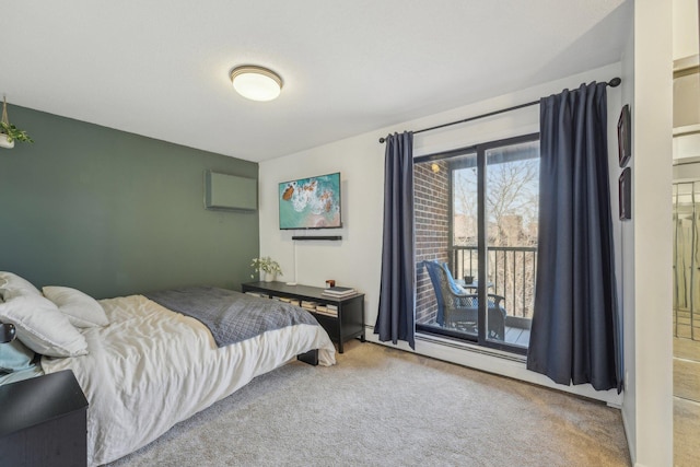 carpeted bedroom featuring access to exterior