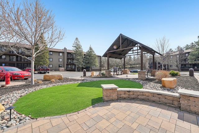 view of community featuring a lawn and a gazebo