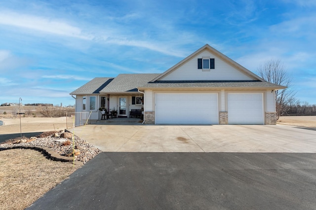 26141 Jonquil Ave, New Market Twp, MN 55020 - view of front facade with concrete driveway, a garage, a shingled roof, and brick siding