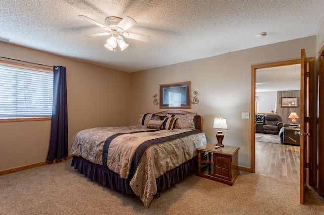 26141 Jonquil Ave, New Market Twp, MN 55020 - carpeted bedroom with ceiling fan, baseboards, and a textured ceiling