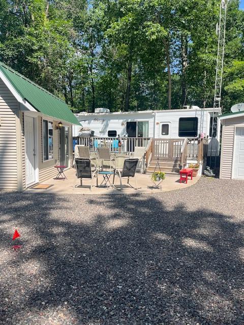 view of yard with an outdoor structure and a deck