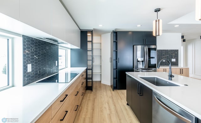 8030 59th St S, Horace, ND 58047 - kitchen with appliances with stainless steel finishes, a sink, light countertops, modern cabinets, and recessed lighting