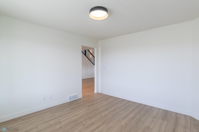 8030 59th St S, Horace, ND 58047 - spare room with light wood finished floors, baseboards, and stairs