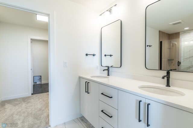 8030 59th St S, Horace, ND 58047 - full bathroom with double vanity, a shower stall, and baseboards