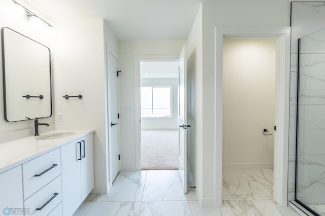 8030 59th St S, Horace, ND 58047 - bathroom with marble look tile flooring, vanity, baseboards, and a marble finish shower