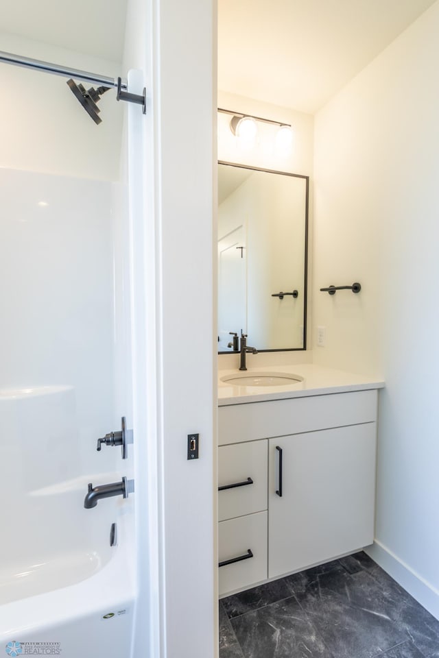 8030 59th St S, Horace, ND 58047 - full bathroom featuring vanity, baseboards, marble look tile flooring, and bathtub / shower combination