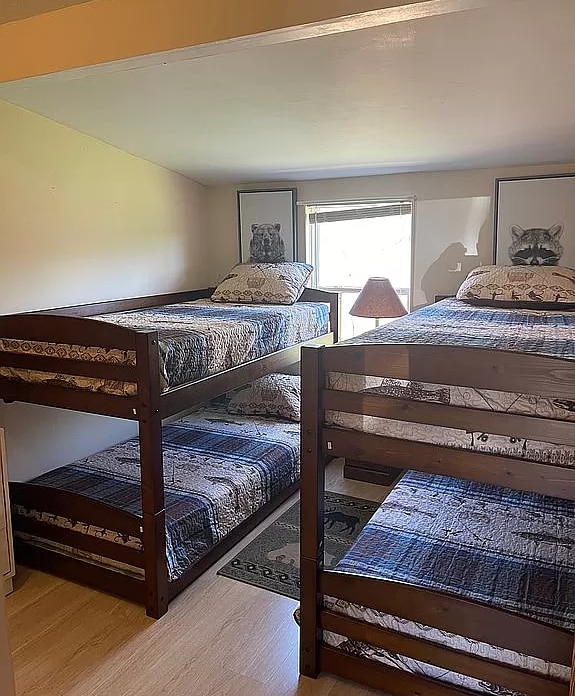 bedroom with wood finished floors