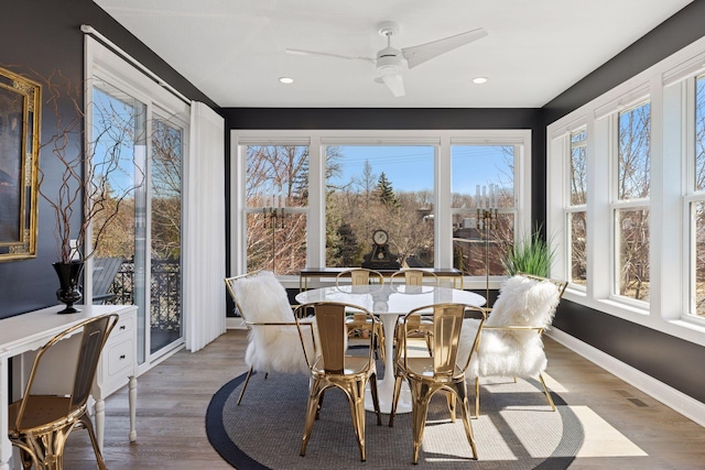 sunroom / solarium featuring baseboards, recessed lighting, wood finished floors, and visible vents