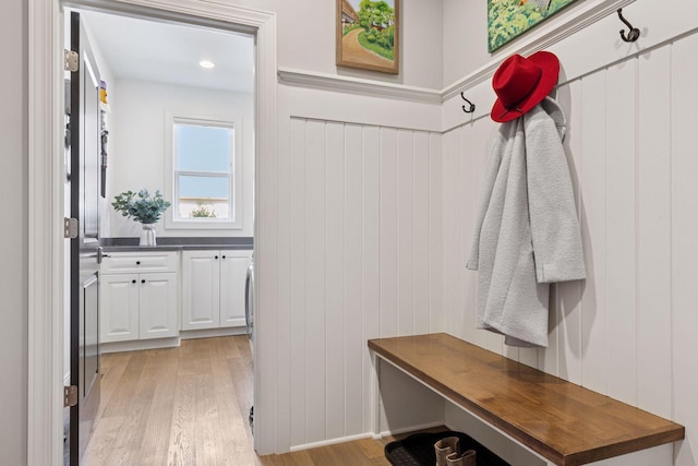 mudroom with light wood-style flooring