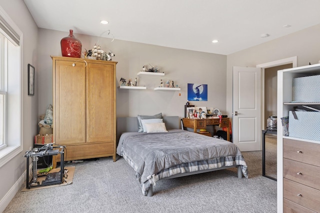 bedroom with recessed lighting and light carpet