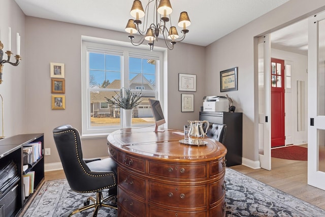 208 Byrondale Ave, Wayzata, MN 55391 - office area featuring a chandelier, light wood finished floors, and baseboards