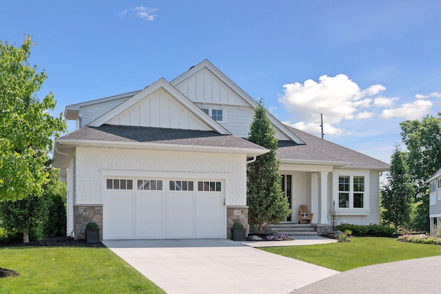 208 Byrondale Ave, Wayzata, MN 55391 - view of front of house with roof with shingles, a front yard, an attached garage, driveway, and board and batten siding