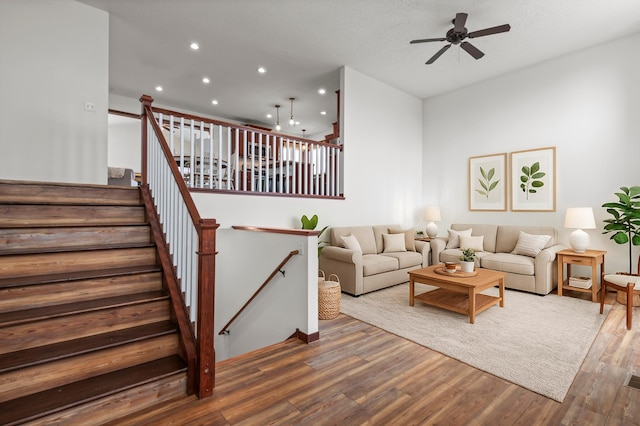 living room featuring recessed lighting, a ceiling fan, and wood finished floors