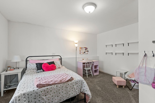 bedroom with baseboards and carpet
