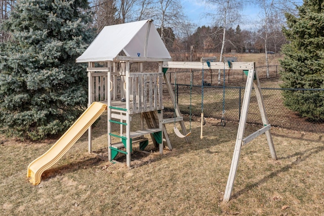 view of play area featuring fence and a yard