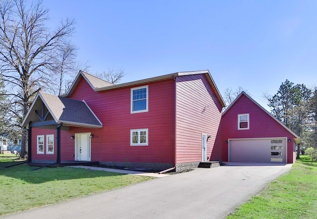 718 Main Ave N, Park Rapids, MN 56470 - view of front of property with a front lawn, driveway, and an outbuilding