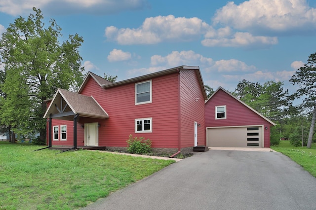 718 Main Ave N, Park Rapids, MN 56470 - view of front of house featuring asphalt driveway, a front yard, and a garage