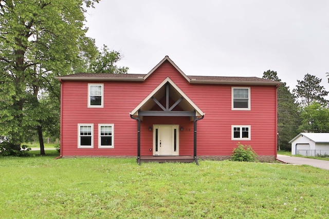 718 Main Ave N, Park Rapids, MN 56470 - view of front of property featuring a front lawn and an outbuilding