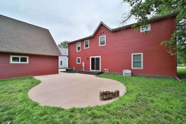 718 Main Ave N, Park Rapids, MN 56470 - rear view of property with a patio area and a lawn