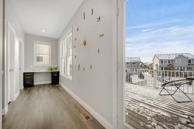 5204 Porchlight, Woodbury, MN 55129 - hall with visible vents, wood finished floors, recessed lighting, a residential view, and baseboards