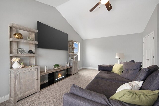 5204 Porchlight, Woodbury, MN 55129 - carpeted living area with a glass covered fireplace, vaulted ceiling, baseboards, and ceiling fan