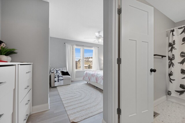 5204 Porchlight, Woodbury, MN 55129 - bedroom featuring baseboards, ceiling fan, and light wood finished floors