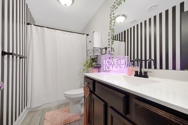 5204 Porchlight, Woodbury, MN 55129 - bathroom with visible vents, toilet, curtained shower, vanity, and wood tiled floor