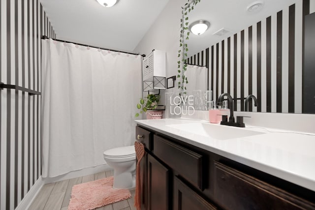 5204 Porchlight, Woodbury, MN 55129 - bathroom featuring visible vents, toilet, vanity, and a shower with curtain