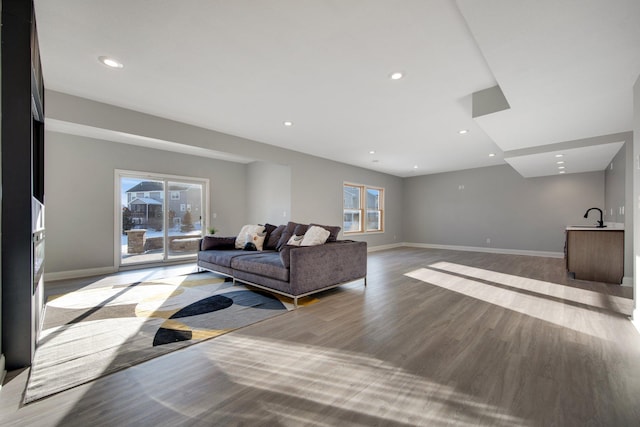 5204 Porchlight, Woodbury, MN 55129 - living area with recessed lighting, baseboards, and wood finished floors