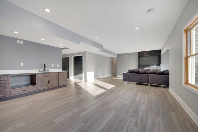 5204 Porchlight, Woodbury, MN 55129 - living room with light wood-style flooring, recessed lighting, and baseboards