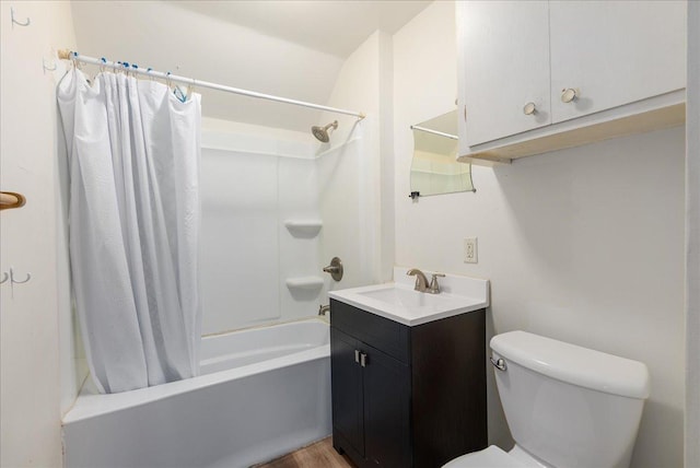 full bathroom featuring shower / tub combo with curtain, toilet, and vanity