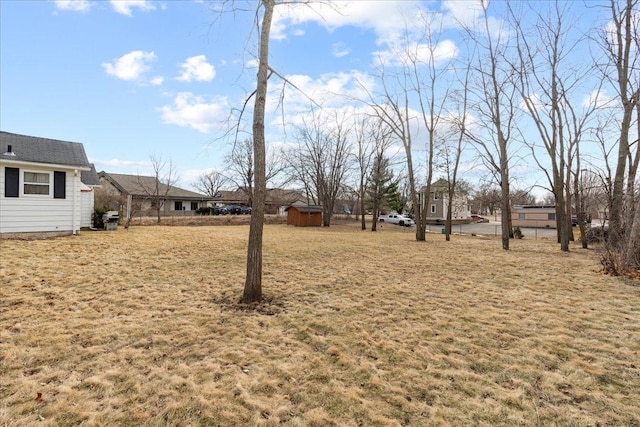 view of yard with an outbuilding and a storage unit