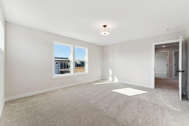 10071 Arrowwood Trl, Woodbury, MN 55129 - carpeted spare room with baseboards