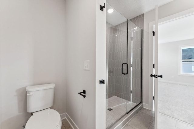 10071 Arrowwood Trl, Woodbury, MN 55129 - bathroom featuring a stall shower and tile patterned flooring