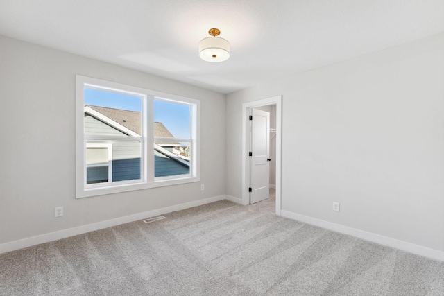 10071 Arrowwood Trl, Woodbury, MN 55129 - carpeted spare room with baseboards