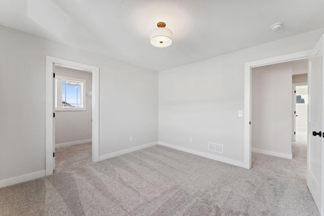 10071 Arrowwood Trl, Woodbury, MN 55129 - carpeted empty room featuring a smoke detector and baseboards