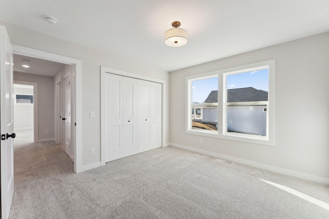 10071 Arrowwood Trl, Woodbury, MN 55129 - unfurnished bedroom featuring carpet floors and a closet