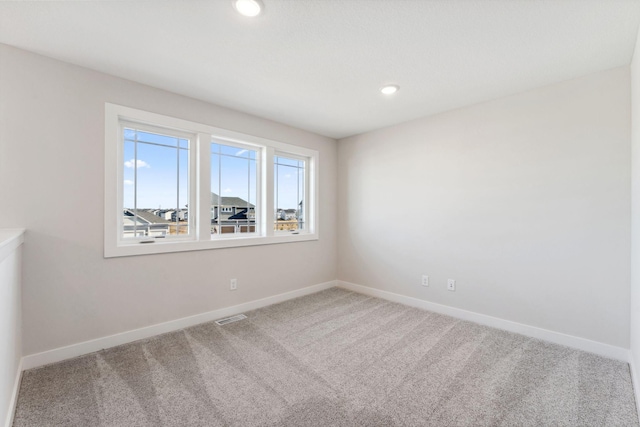 10071 Arrowwood Trl, Woodbury, MN 55129 - carpeted spare room featuring baseboards and recessed lighting