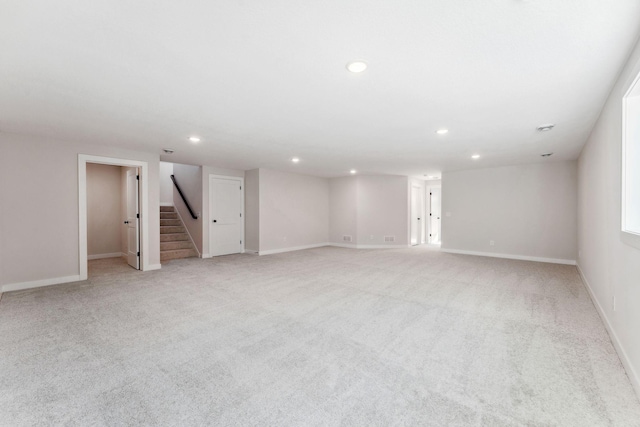 10071 Arrowwood Trl, Woodbury, MN 55129 - unfurnished room featuring recessed lighting, stairs, and light carpet