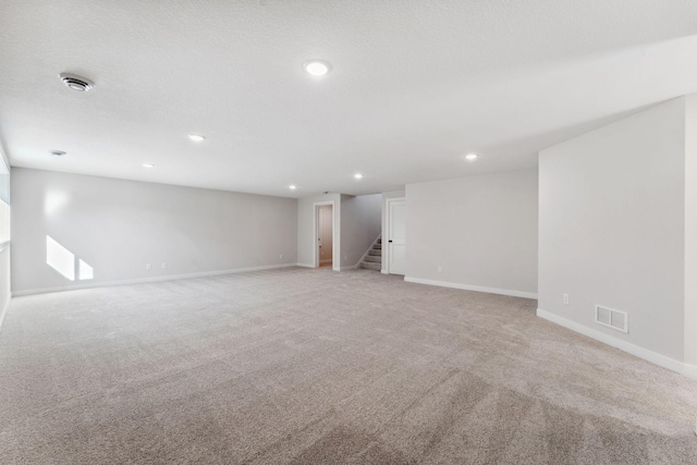 10071 Arrowwood Trl, Woodbury, MN 55129 - unfurnished room with light carpet, stairway, recessed lighting, and a smoke detector
