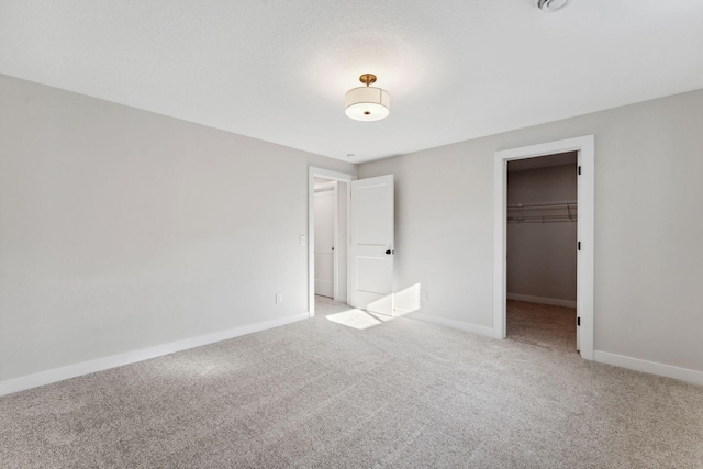 10071 Arrowwood Trl, Woodbury, MN 55129 - unfurnished bedroom with light colored carpet, a spacious closet, and a closet