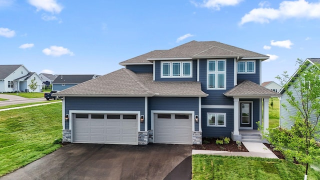 10071 Arrowwood Trl, Woodbury, MN 55129 - view of front facade with driveway, a front lawn, a shingled roof, a garage, and a residential view