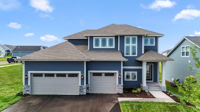 10071 Arrowwood Trl, Woodbury, MN 55129 - view of front facade featuring asphalt driveway, a shingled roof, and an attached garage
