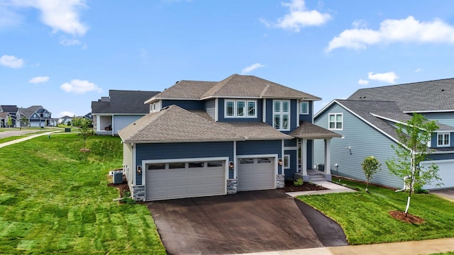 10071 Arrowwood Trl, Woodbury, MN 55129 - view of front of home featuring driveway, a residential view, a front lawn, and a shingled roof