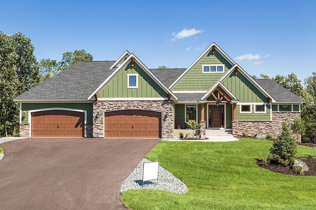 16999 Dakota St NW, Andover, MN 55304 - craftsman-style home with aphalt driveway, board and batten siding, and stone siding