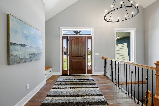 16999 Dakota St NW, Andover, MN 55304 - entryway featuring dark wood finished floors, an inviting chandelier, baseboards, and high vaulted ceiling