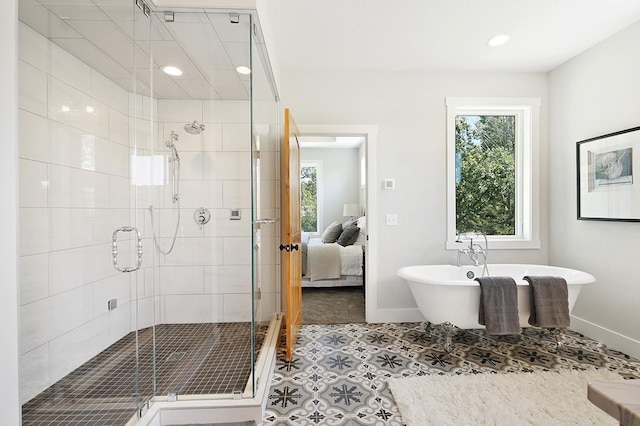 16999 Dakota St NW, Andover, MN 55304 - full bathroom with recessed lighting, a shower stall, a freestanding bath, and baseboards