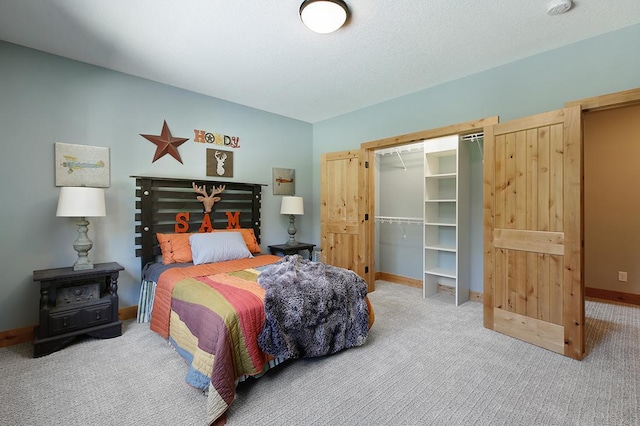 16999 Dakota St NW, Andover, MN 55304 - carpeted bedroom featuring a closet, baseboards, and a textured ceiling
