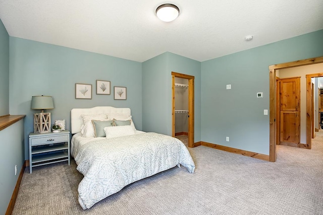 16999 Dakota St NW, Andover, MN 55304 - carpeted bedroom with a spacious closet, baseboards, a closet, and a textured ceiling